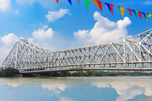 A picture of Howrah bridge during the day with blue sky